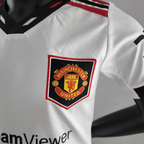 Kit Infantil Manchester United Reserva 22/23